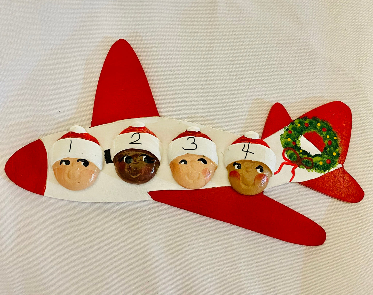 Airplane with 4 Santa Heads