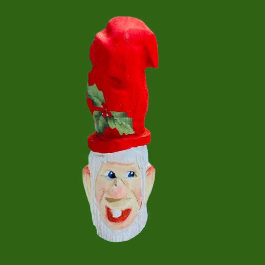 Hand Carved Santa Claus with a toothy smile and painted holly on a tall red hat  Christmas Ornament 4"
